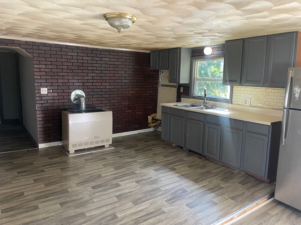 3216 North Main Street Fall River, MA 02720 - Photo 23 of 42 a bathroom with a sink and a mirror