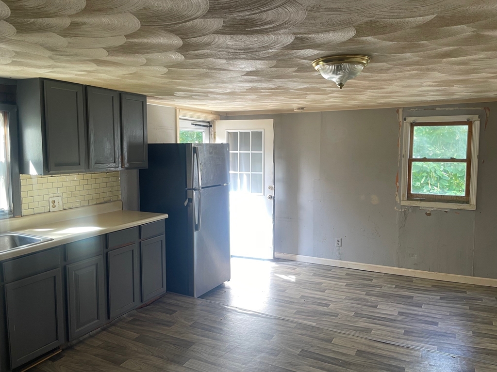 3216 North Main Street Fall River, MA 02720 - Photo 24 of 42 a kitchen with stainless steel appliances granite countertop a refrigerator and a sink