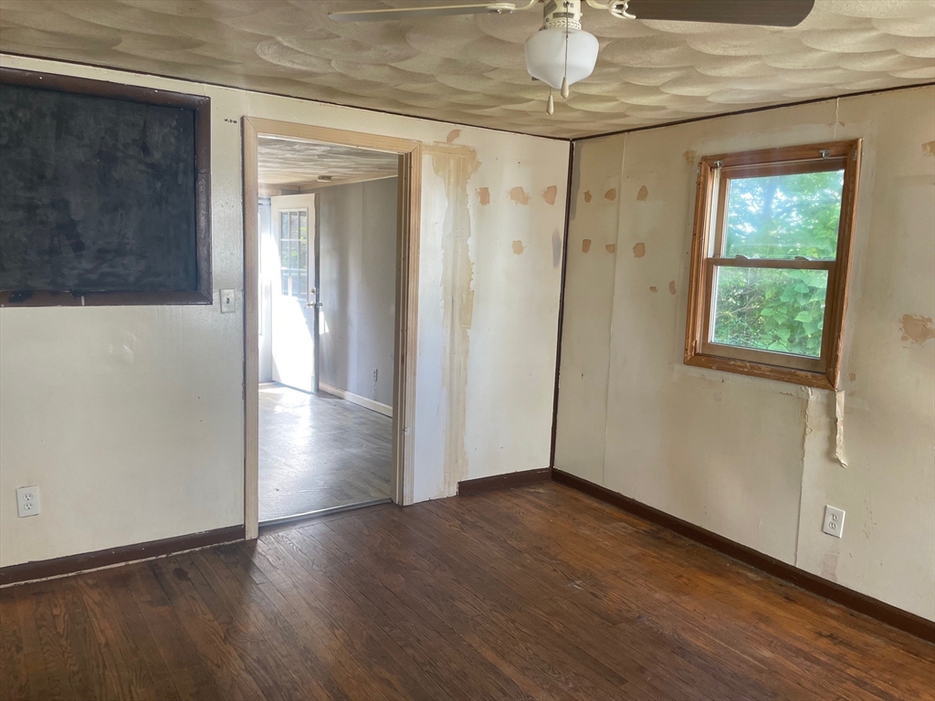 3216 North Main Street Fall River, MA 02720 - Photo 27 of 42 an empty room with wooden floor and windows