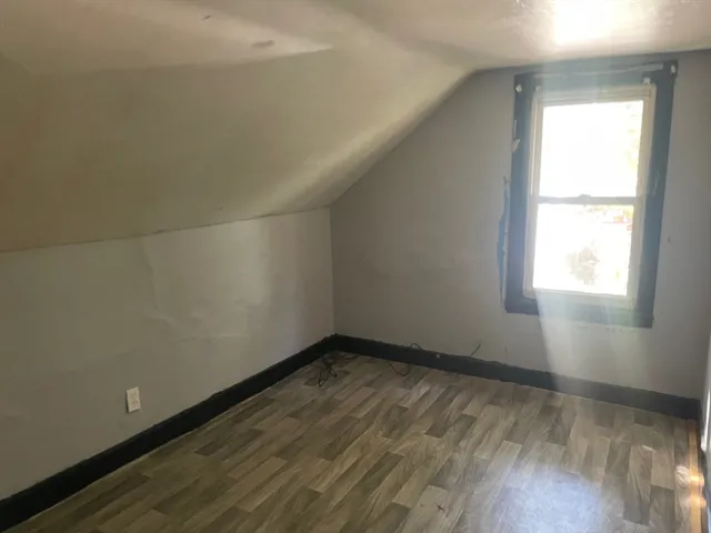 a view of an empty room and a window