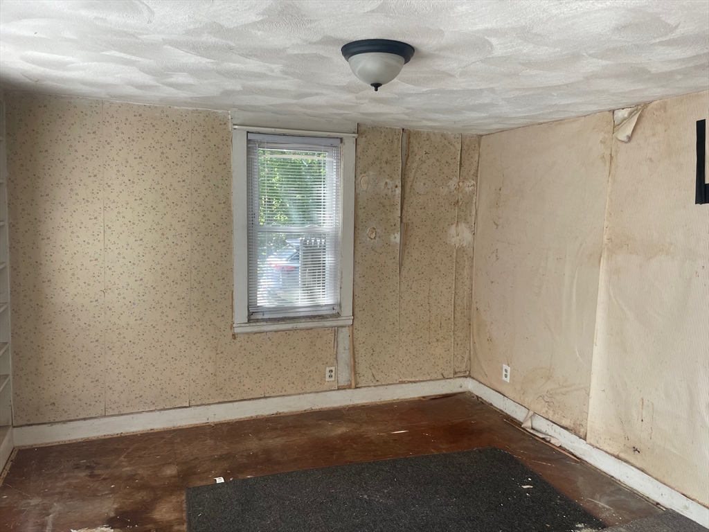 3216 North Main Street Fall River, MA 02720 - Photo 5 of 42 an empty room with a empty space and windows