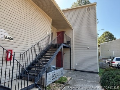 6400 Starbrook Drive, Unit 7 Fayetteville, NC 28304 - Photo 2 of 12 a view of a house with wooden fence