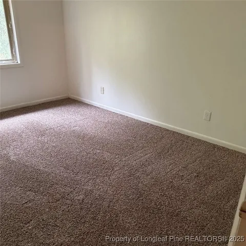 an empty room with a empty space and a window