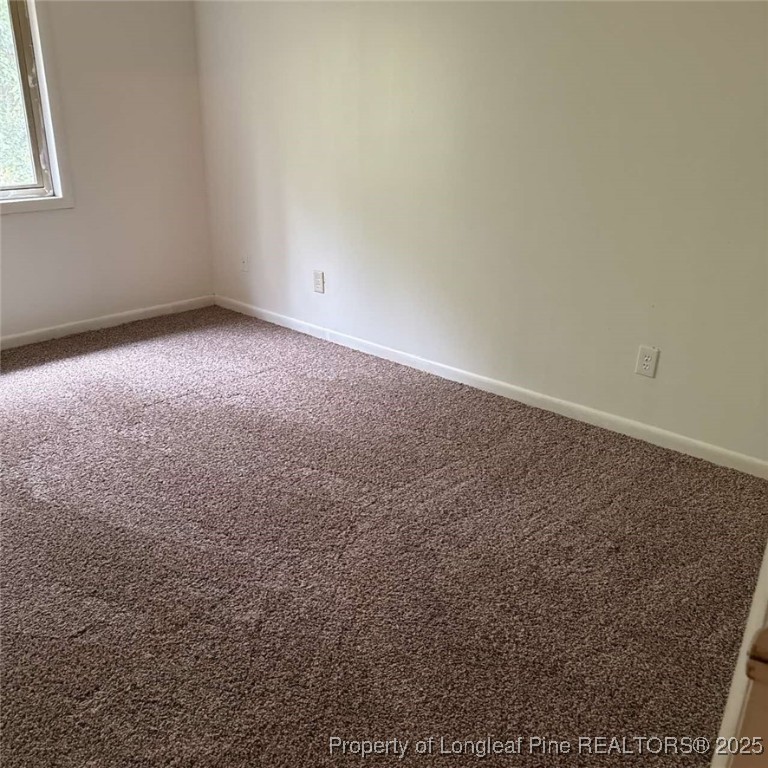 6400 Starbrook Drive, Unit 7 Fayetteville, NC 28304 - Photo 10 of 12 an empty room with a empty space and a window