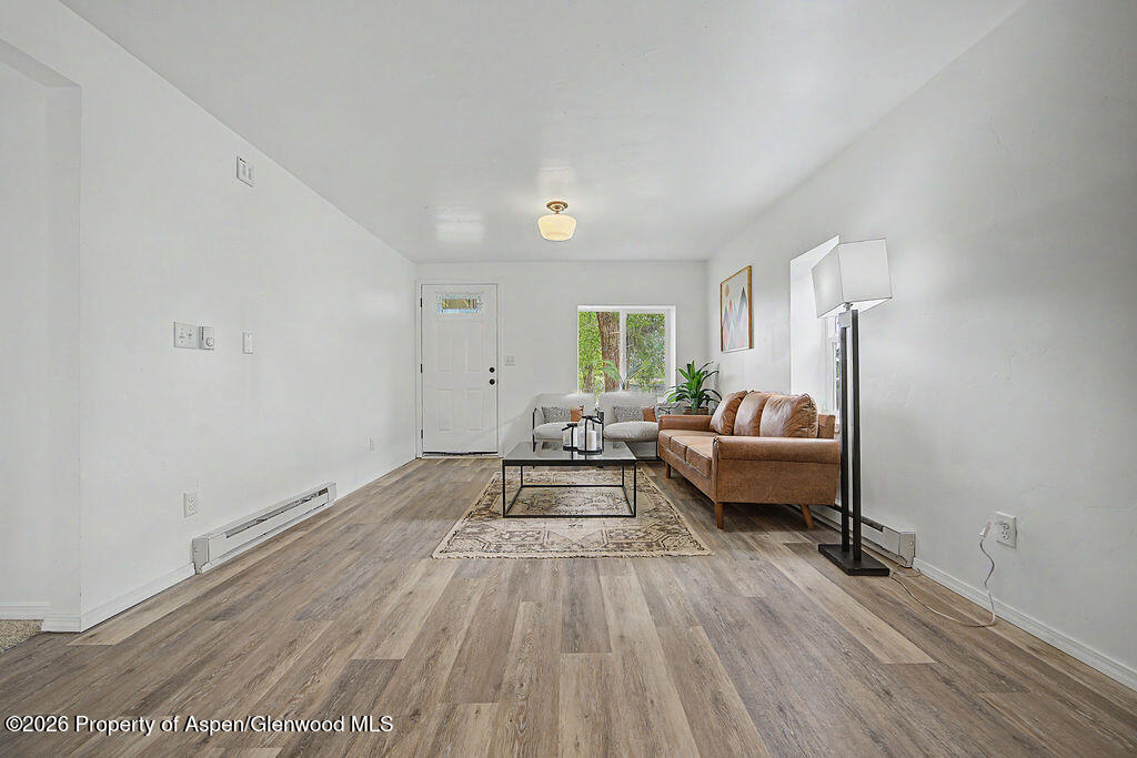 54 South Ranney Street Craig, CO 81625 - Photo 5 of 32 a living room with furniture and a wooden floor