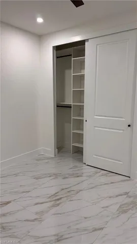 a view of an empty walk in closet