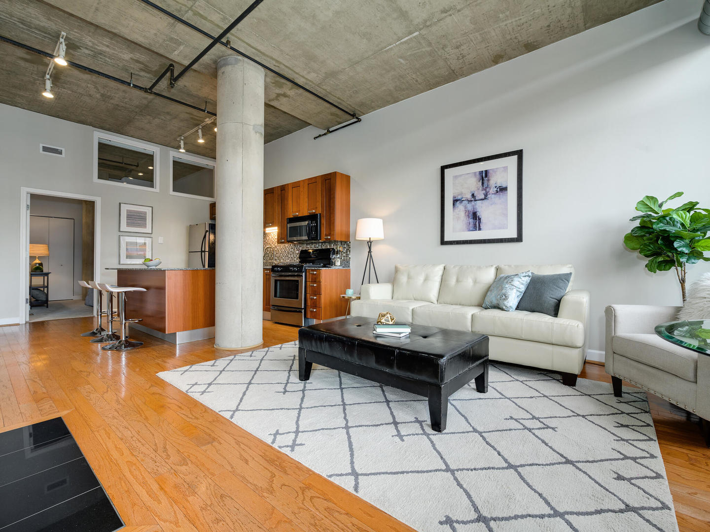 111 South Morgan Street, Unit 811 Chicago, IL 60607 - Photo 11 of 21 a living room with furniture a dining table and a potted plant