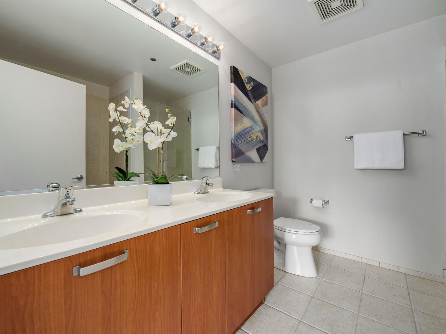 111 South Morgan Street, Unit 811 Chicago, IL 60607 - Photo 15 of 21 a bathroom with a sink a toilet and mirror