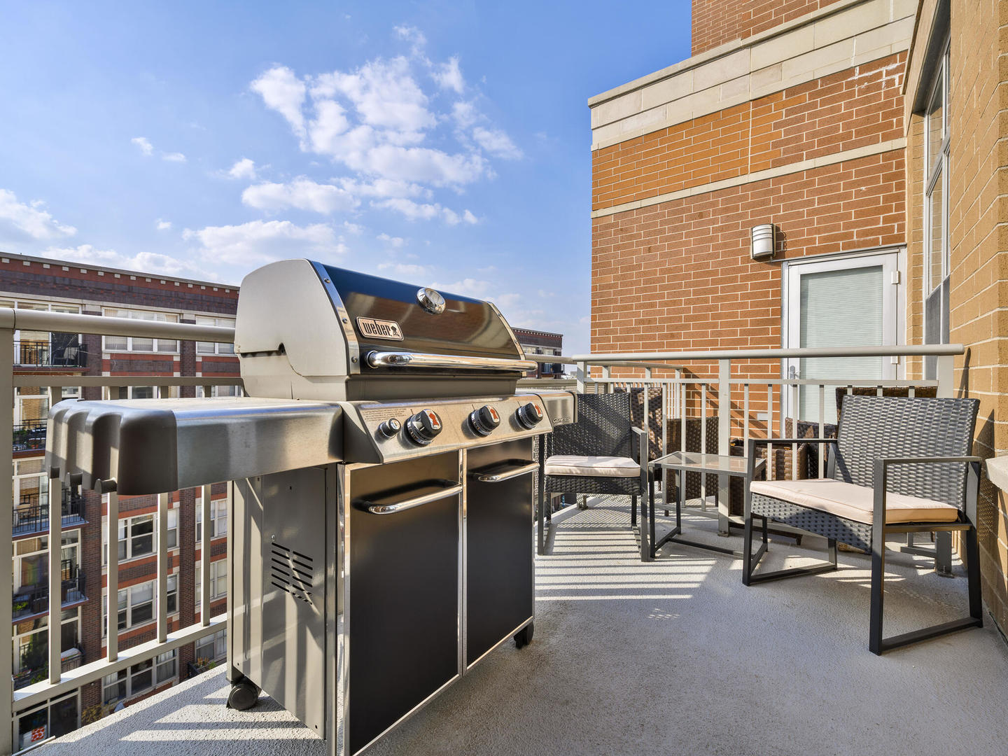 111 South Morgan Street, Unit 811 Chicago, IL 60607 - Photo 20 of 21 a view of a chairs and tables in balcony