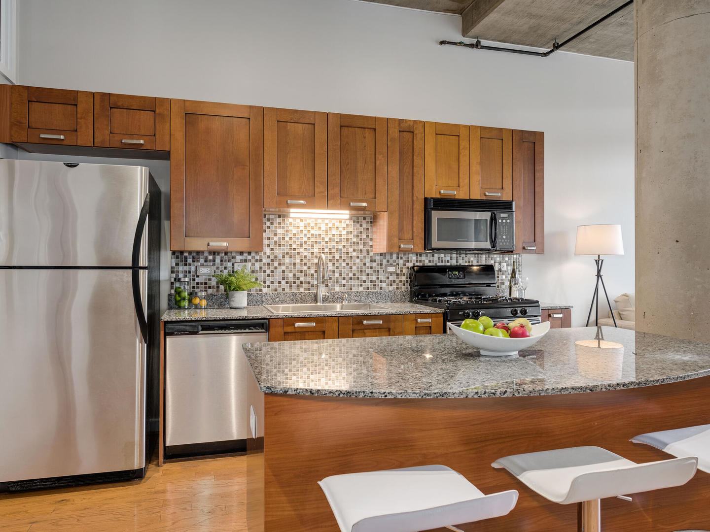 111 South Morgan Street, Unit 811 Chicago, IL 60607 - Photo 5 of 21 a kitchen with stainless steel appliances granite countertop a refrigerator stove top oven a sink and dishwasher
