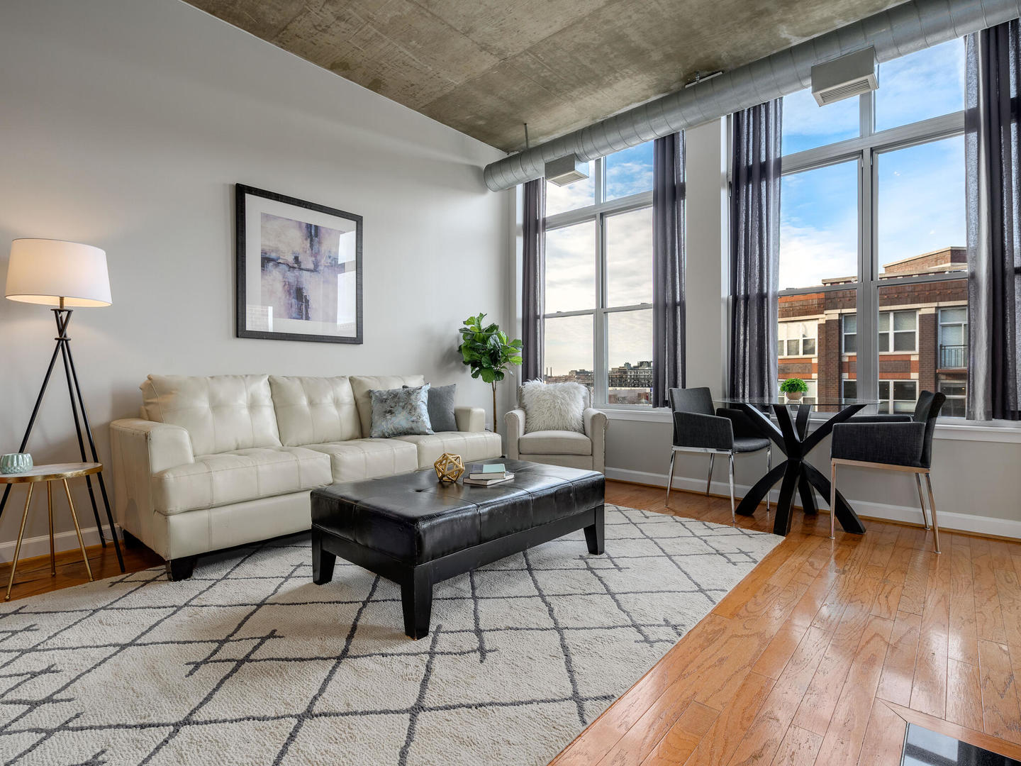 111 South Morgan Street, Unit 811 Chicago, IL 60607 - Photo 9 of 21 a living room with furniture and a large window
