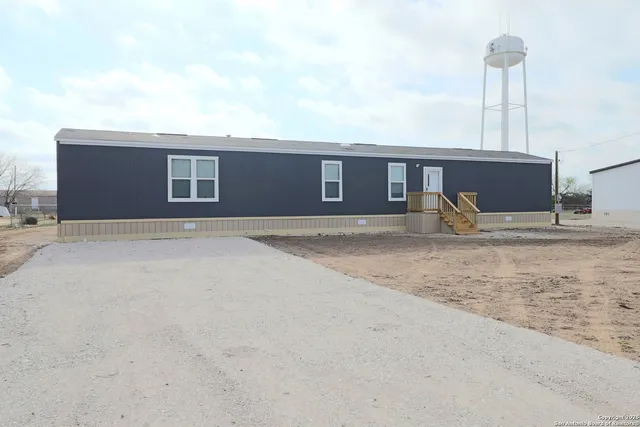 a house view with a backyard space