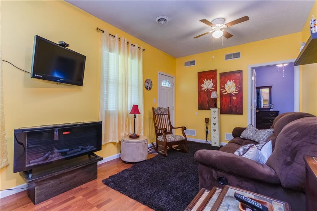 601 Virginia Avenue Rochester, PA 15074 - Photo 7 of 23 a living room with furniture and a flat screen tv