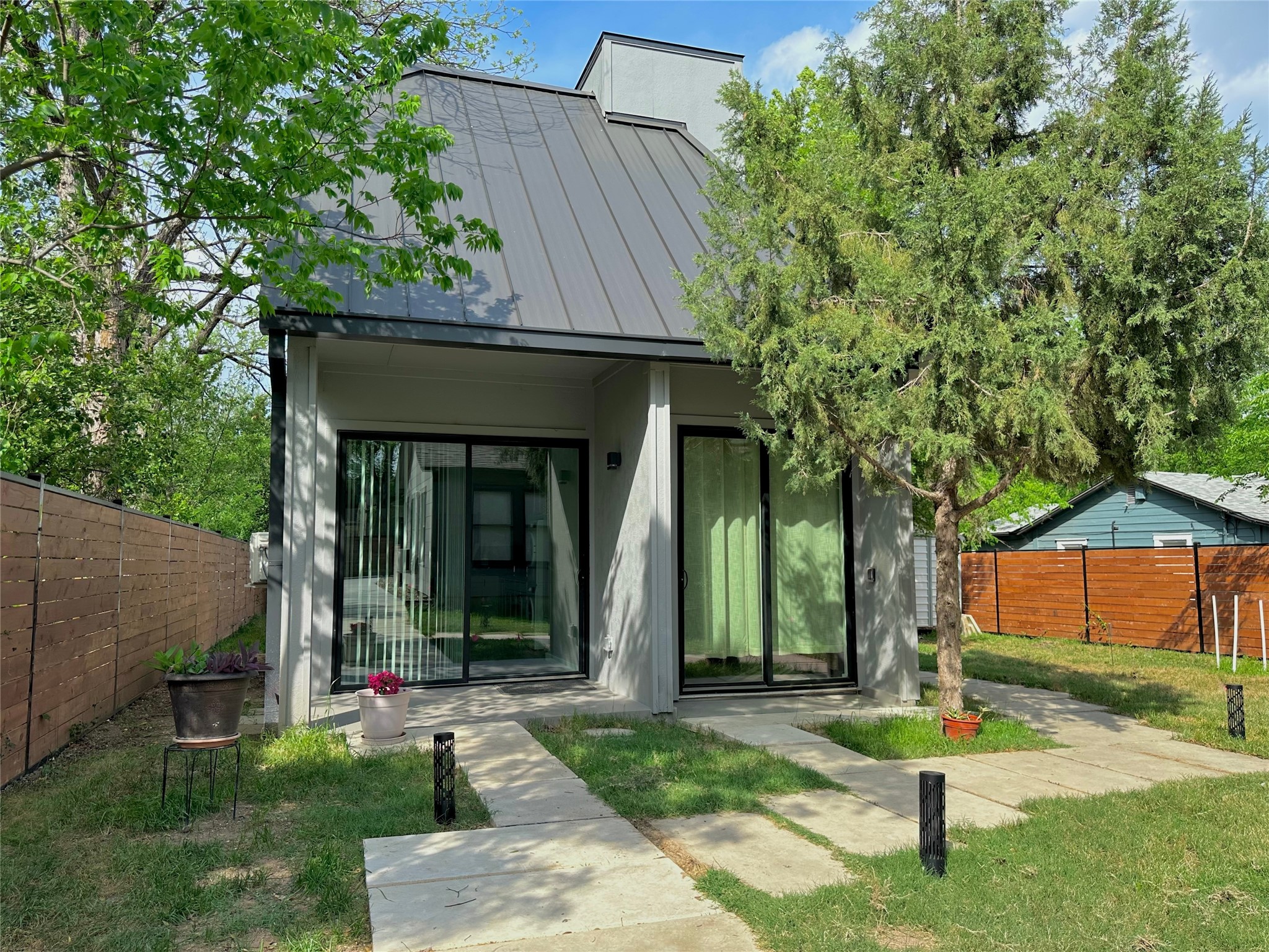 914 East 39th Street, Unit 2 Austin, TX 78751 - Photo 1 of 34 Front view of structure with a standing seam roof
