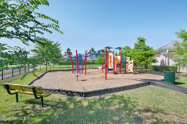 a view of a park with swings and slides