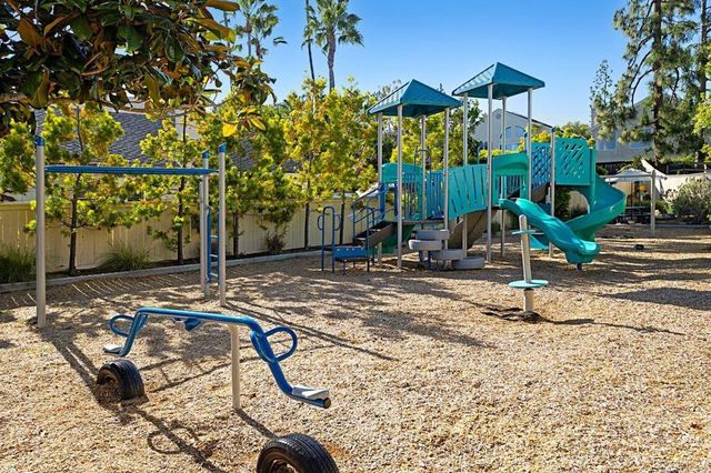 a view of a park with swings
