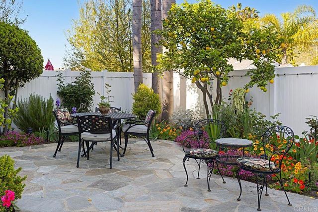a view of a tables and chairs in a patio