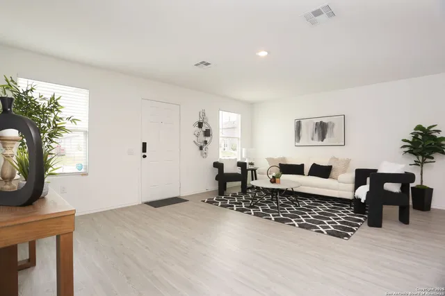 a living room with furniture and a window