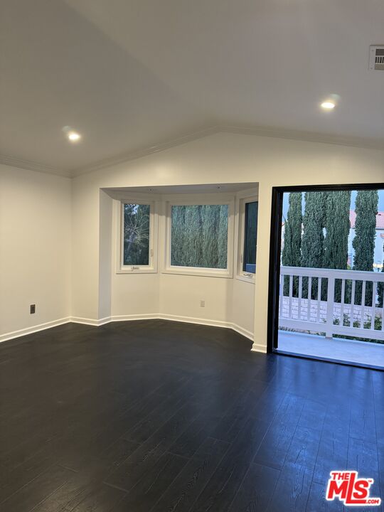12030 Falcon Crest Way Porter Ranch, CA 91326 - Photo 19 of 33 a view of an empty room with wooden floor and fence