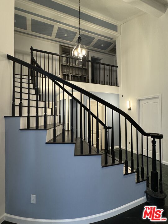 12030 Falcon Crest Way Porter Ranch, CA 91326 - Photo 8 of 33 a view of staircase with railing and a chandelier