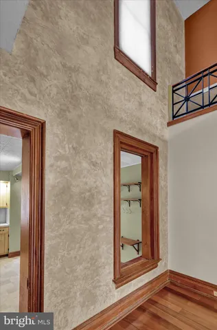 a view of a kitchen with refrigerator and cabinet