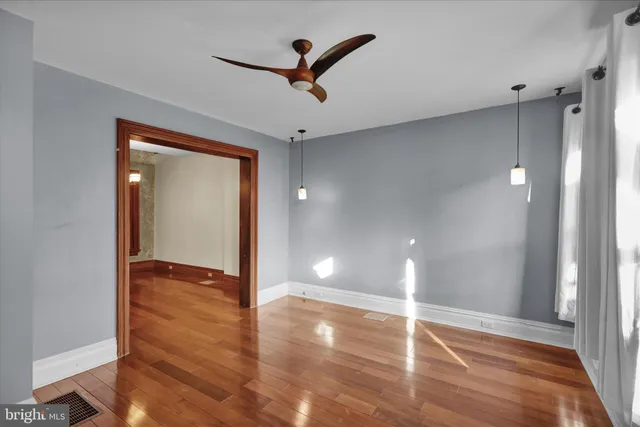 a view of a room with wooden floor and bathroom