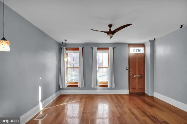 a view of a living room and a chandelier