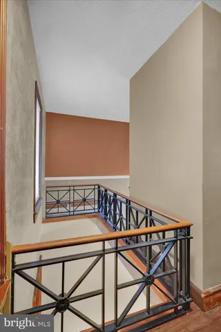 a spacious bedroom with a balcony a bed and a window