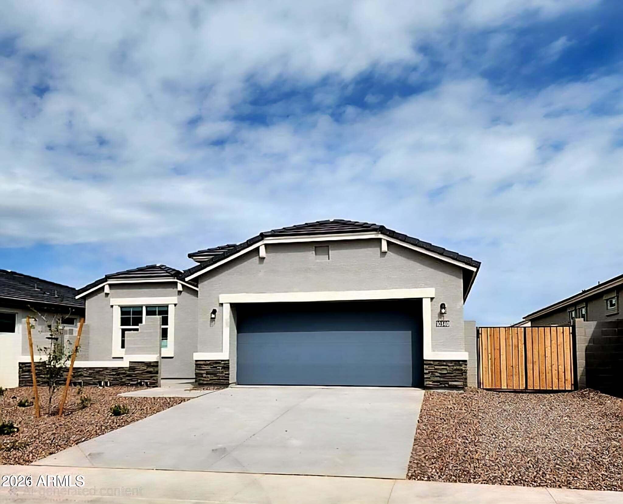 10340 West Chipman Road Tolleson, AZ 85353 - Photo 1 of 1 a front view of a house with a garage