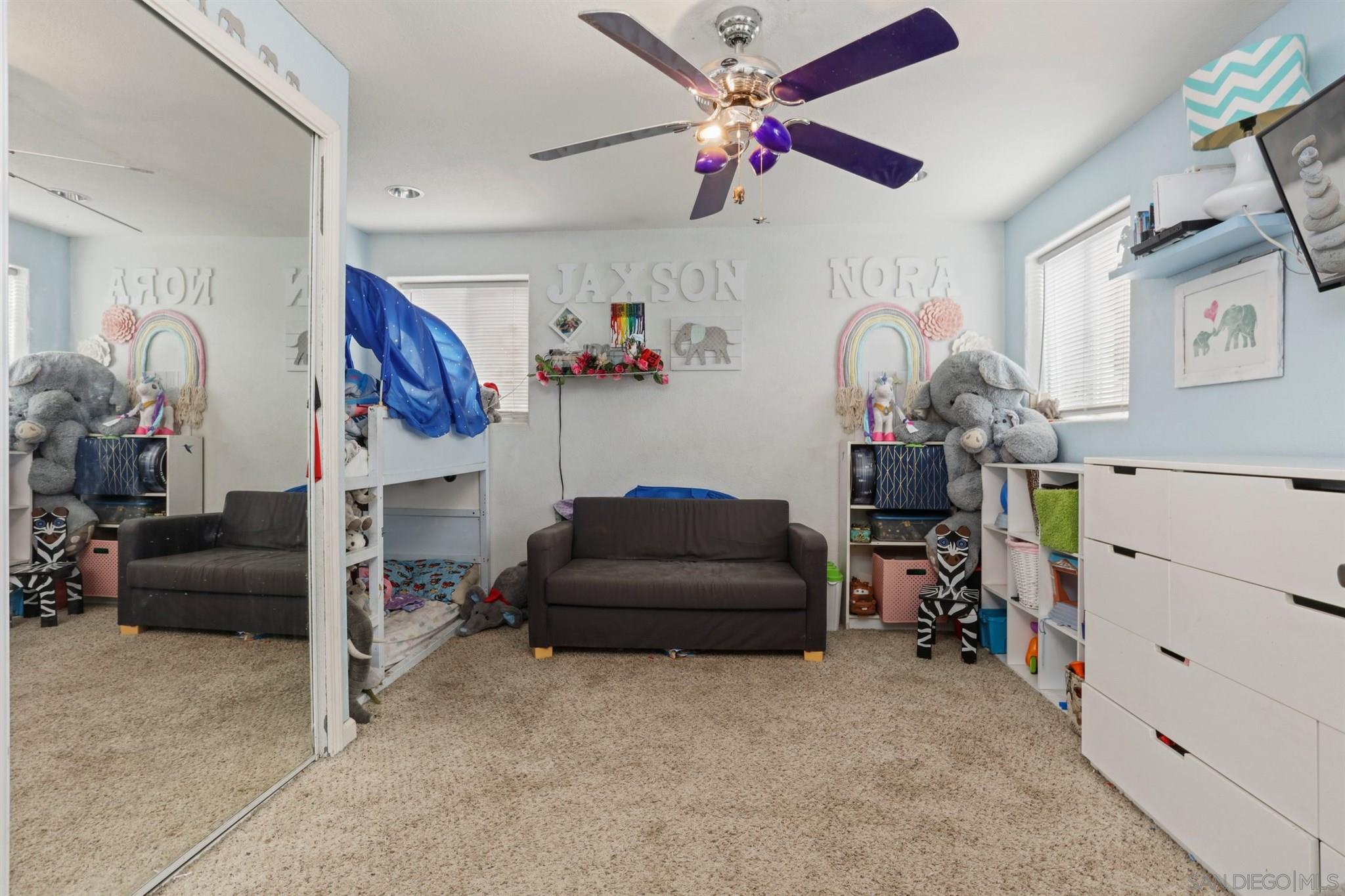 8521 Gaena Road Lakeside, CA 92040 - Photo 16 of 27 a living room with furniture and a flat screen tv