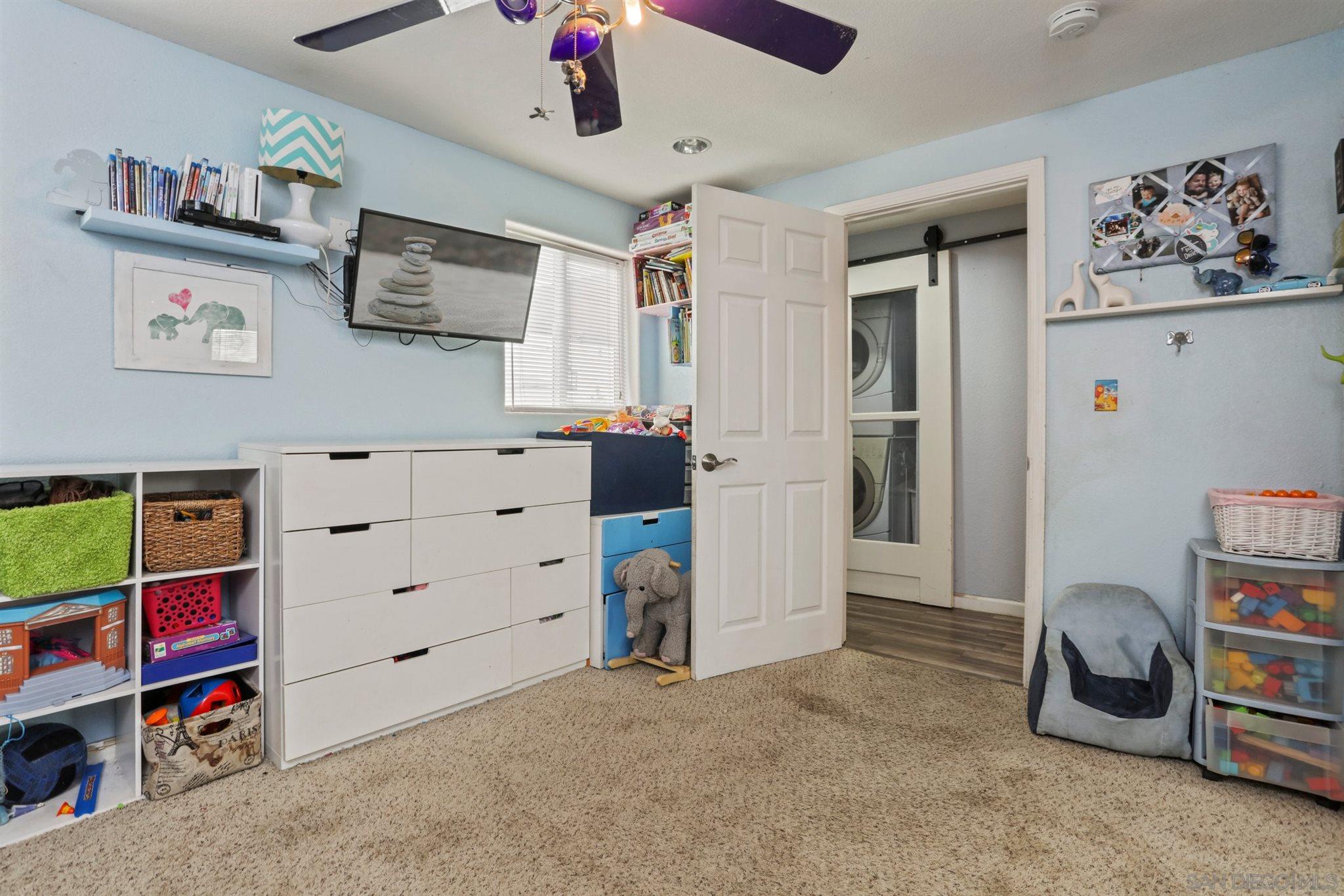 8521 Gaena Road Lakeside, CA 92040 - Photo 17 of 27 a view of room with cabinet and ceiling fan