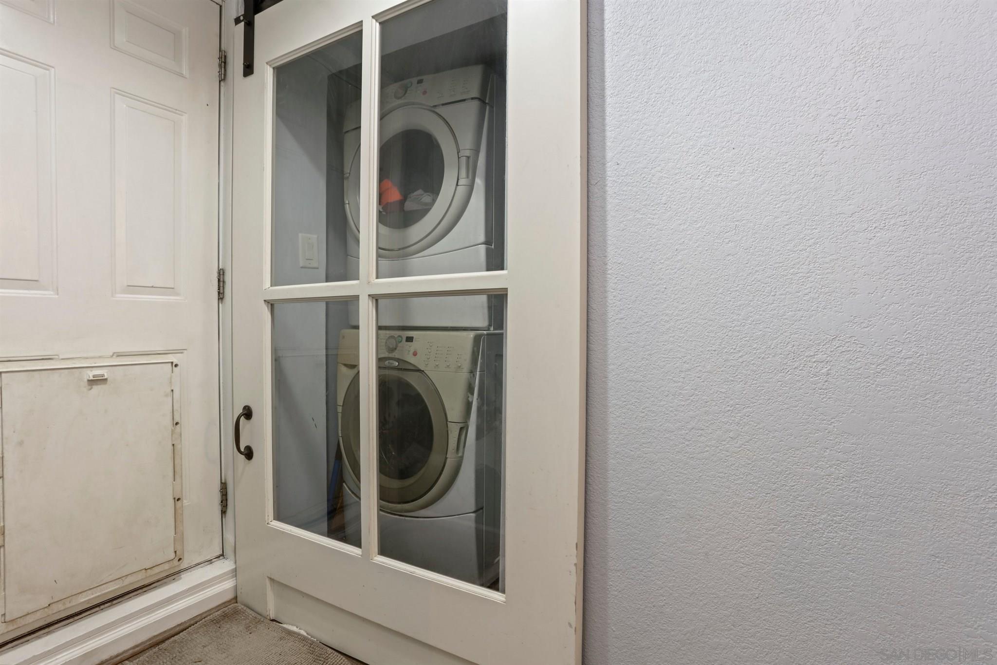 8521 Gaena Road Lakeside, CA 92040 - Photo 18 of 27 a close up view of a washer and dryer