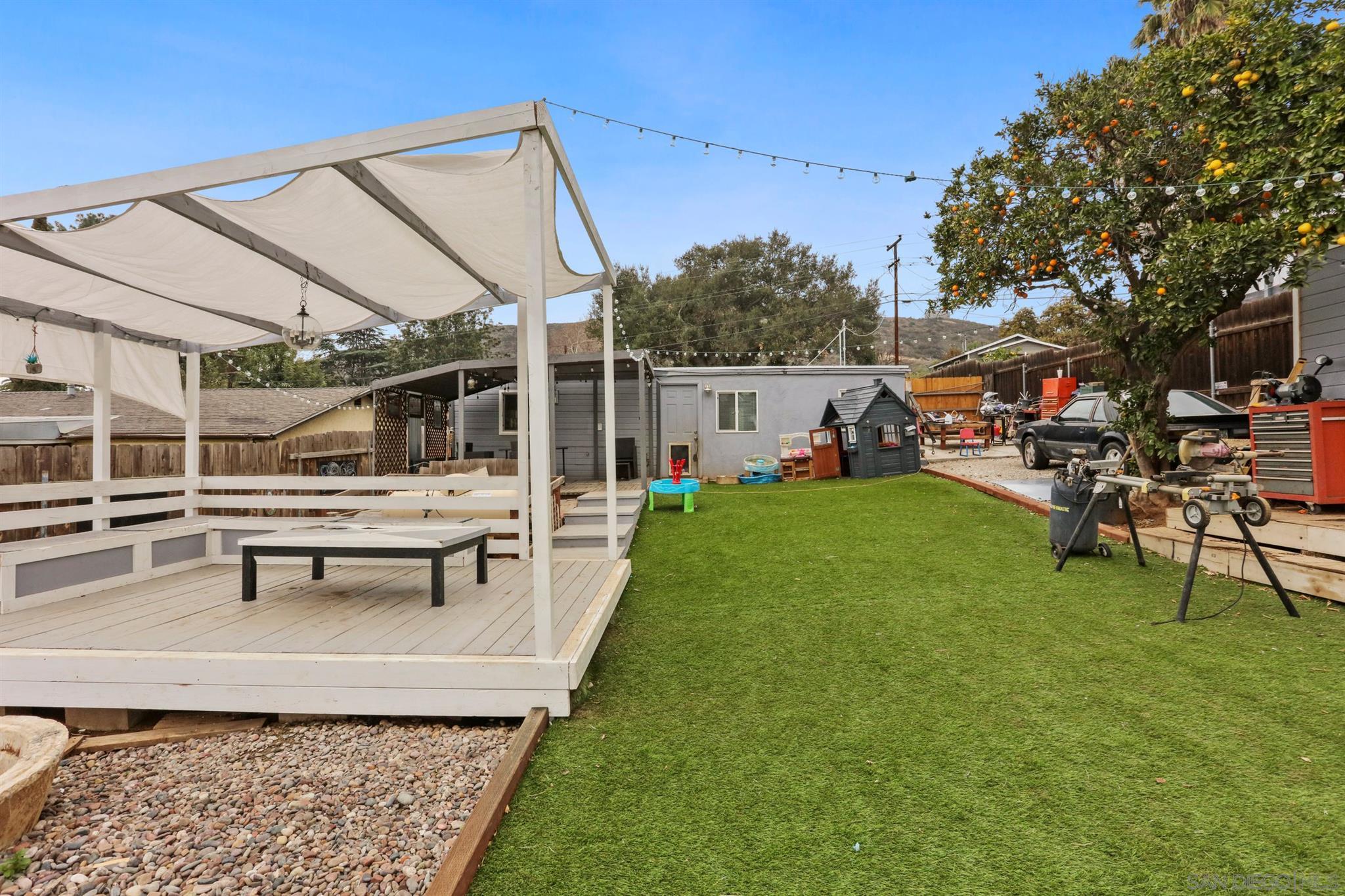 8521 Gaena Road Lakeside, CA 92040 - Photo 21 of 27 a view of a house with backyard sitting area and garden