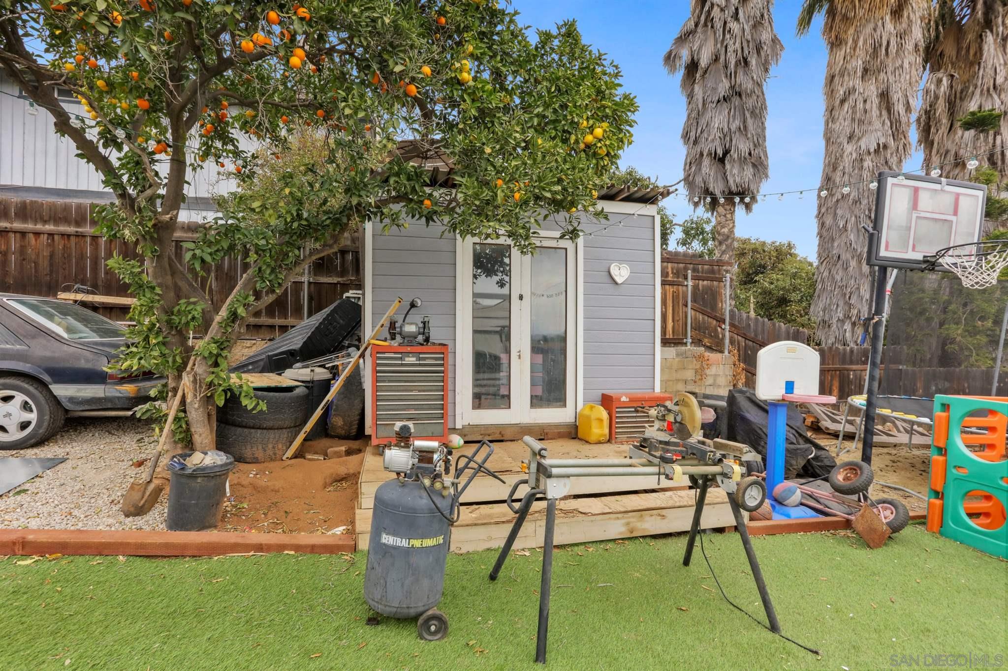 8521 Gaena Road Lakeside, CA 92040 - Photo 22 of 27 a view of a patio with a table and chairs