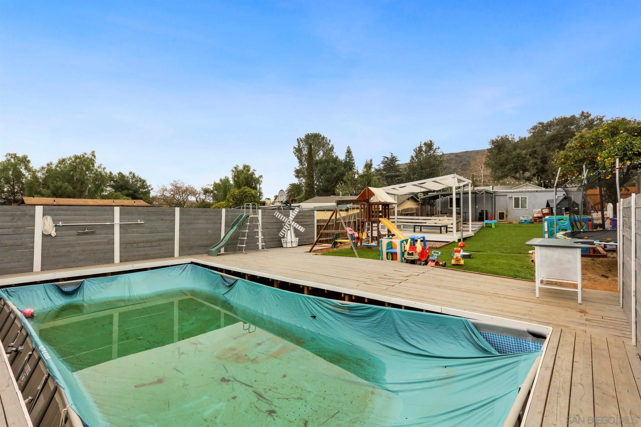 8521 Gaena Road Lakeside, CA 92040 - Photo 24 of 27 a view of a swimming pool with a lounge chairs