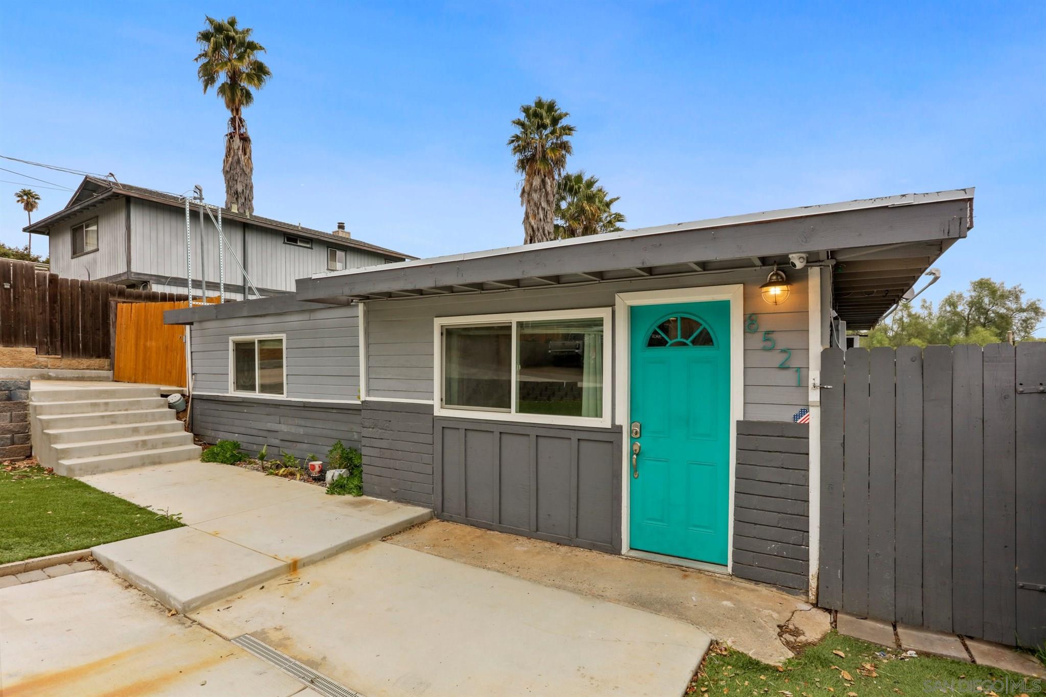 8521 Gaena Road Lakeside, CA 92040 - Photo 4 of 27 a front view of a house with a garden