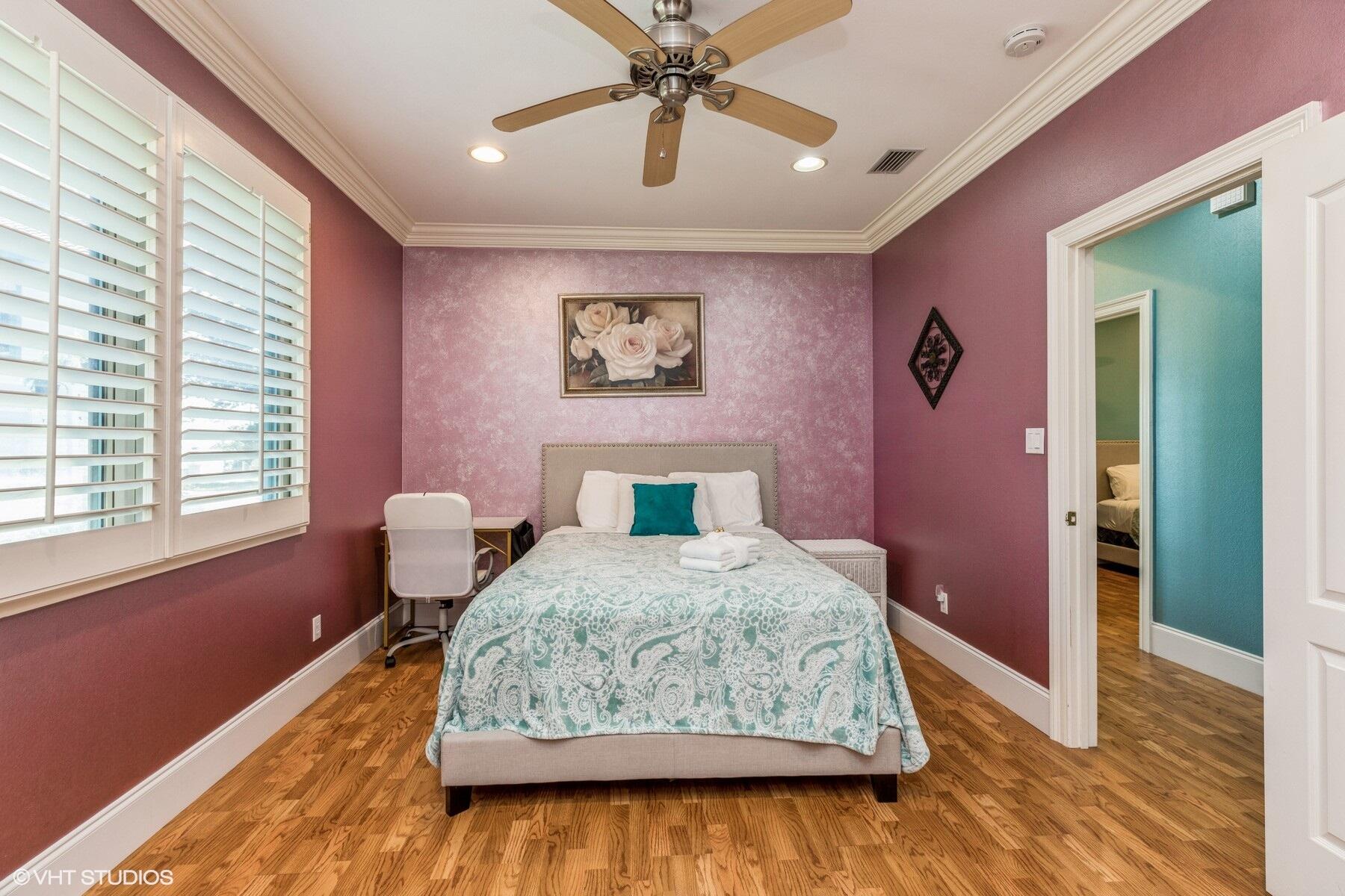13000 Highway 20 Freeport, FL 32439 - Photo 12 of 31 a bedroom with a bed and a chandelier