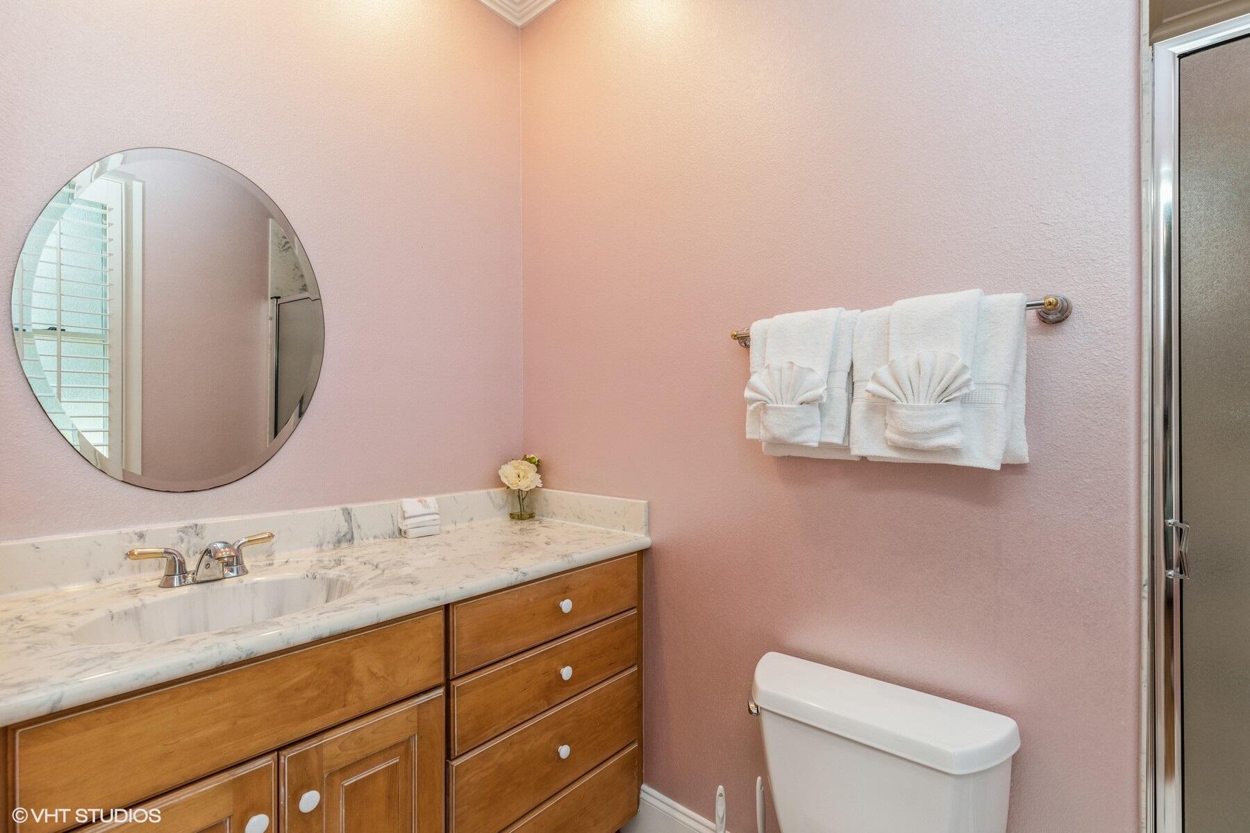 13000 Highway 20 Freeport, FL 32439 - Photo 13 of 31 a bathroom with a granite countertop toilet sink mirror and vanity