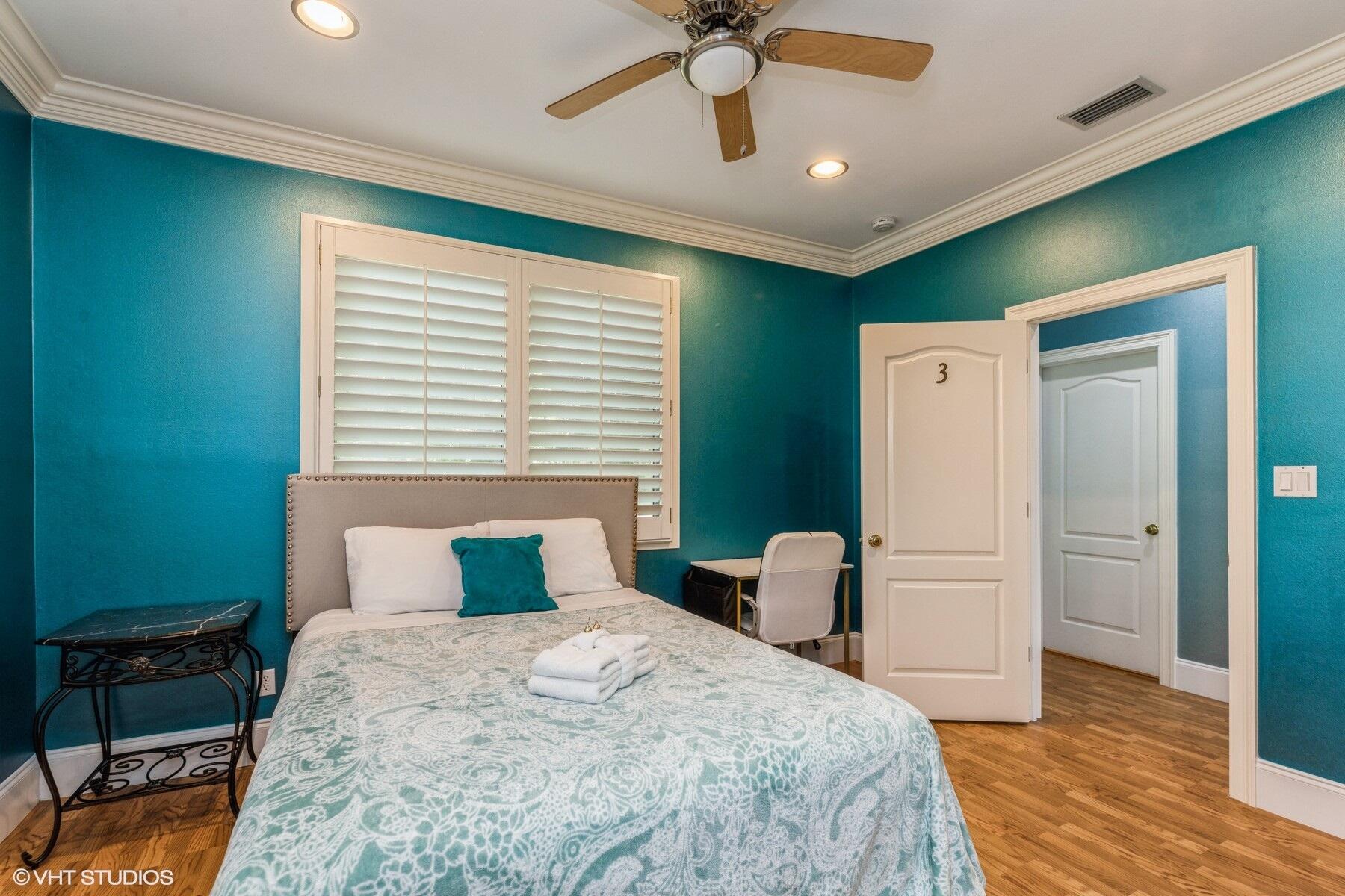 13000 Highway 20 Freeport, FL 32439 - Photo 14 of 31 a bedroom with a bed and a chandelier
