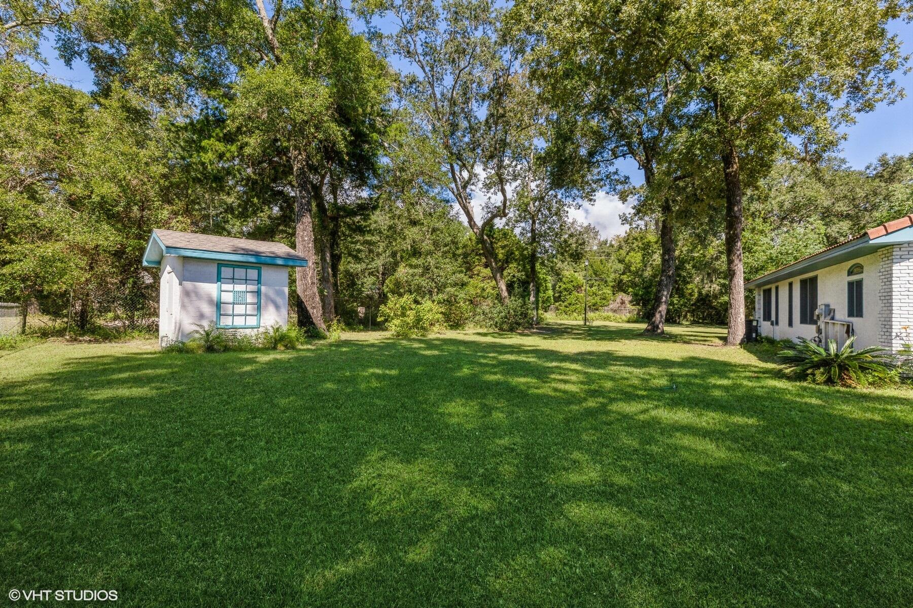 13000 Highway 20 Freeport, FL 32439 - Photo 17 of 31 a view of a house with backyard and a tree