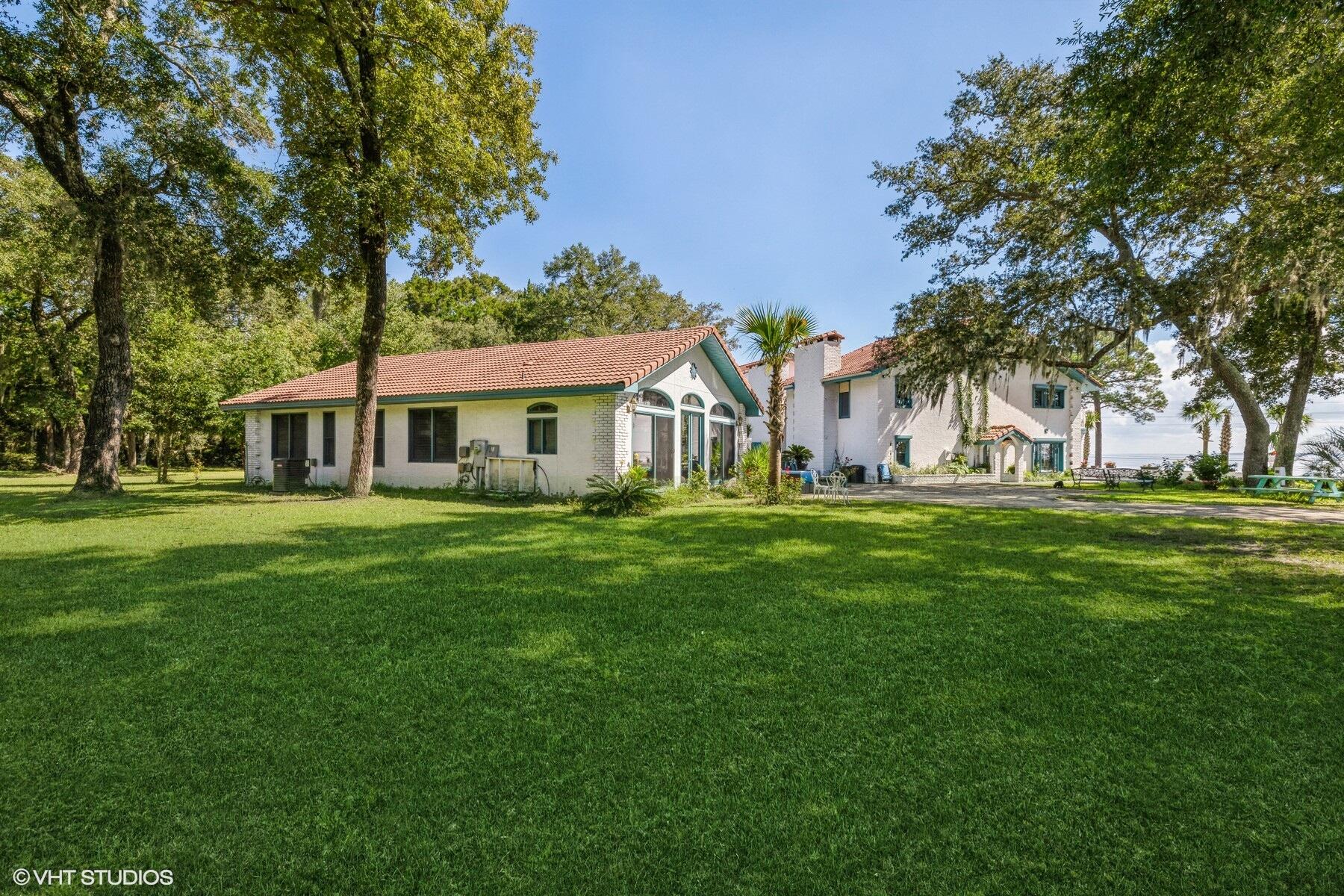13000 Highway 20 Freeport, FL 32439 - Photo 18 of 31 a front view of a house with a garden
