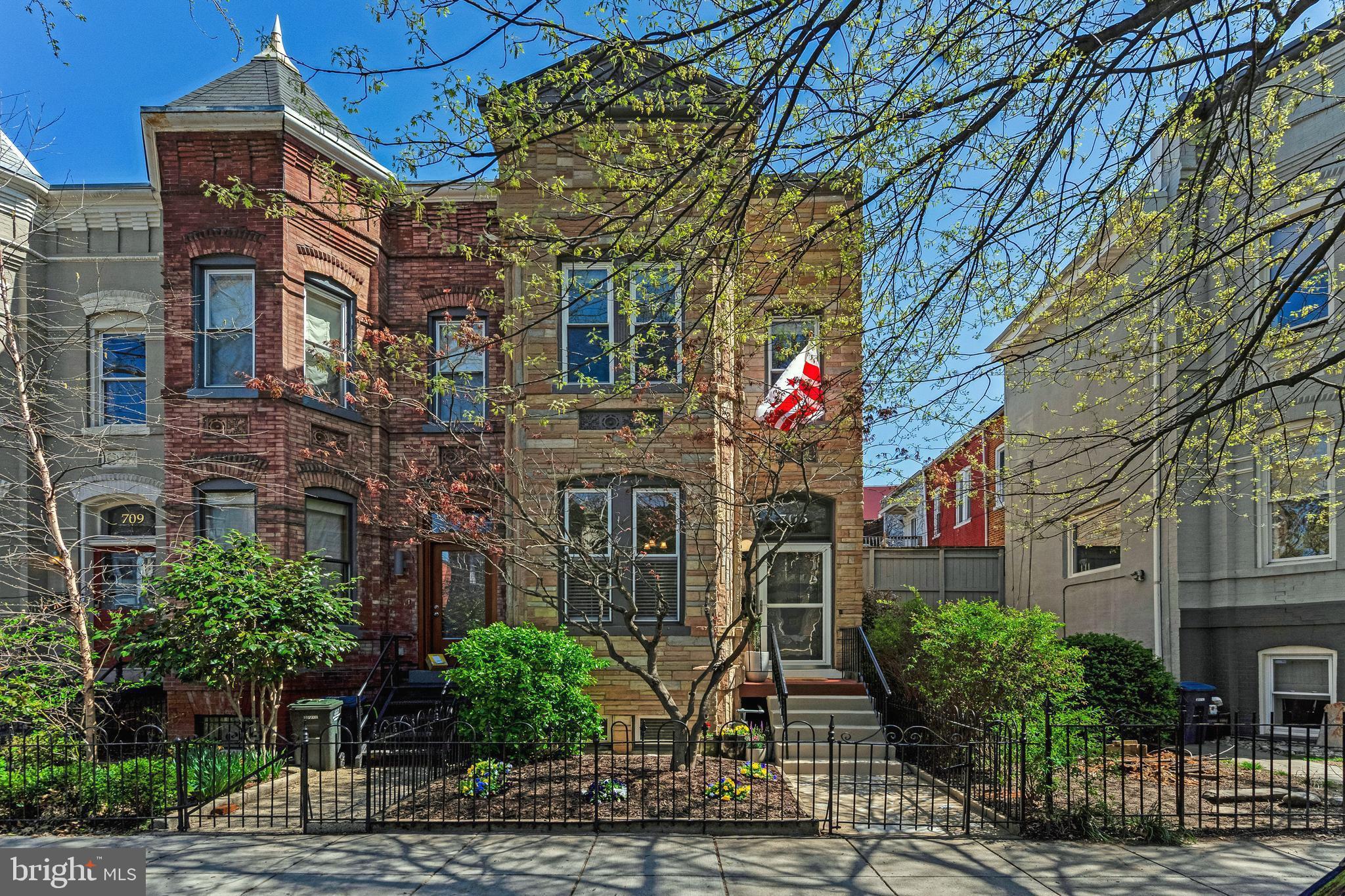 a front view of a building with garden