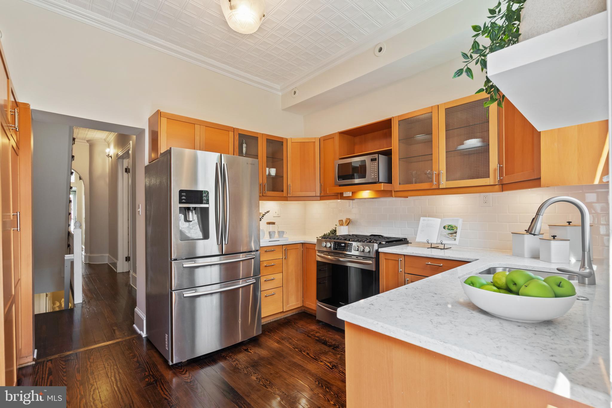 705 7th Street Northeast Washington, DC 20002 - Photo 13 of 48 a kitchen with stainless steel appliances granite countertop a refrigerator a stove top oven a sink and dishwasher