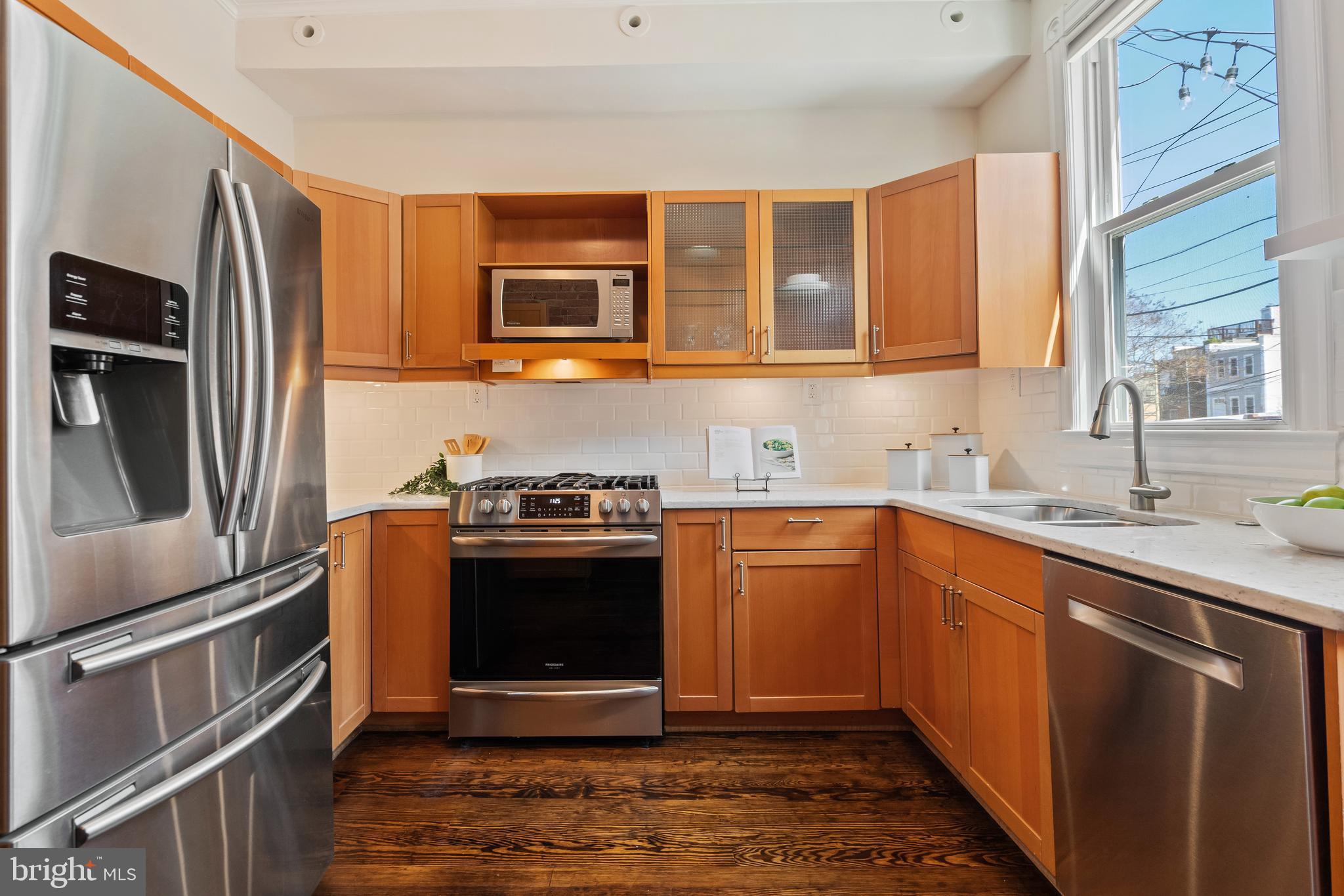 705 7th Street Northeast Washington, DC 20002 - Photo 14 of 48 a kitchen with stainless steel appliances granite countertop a refrigerator stove and sink