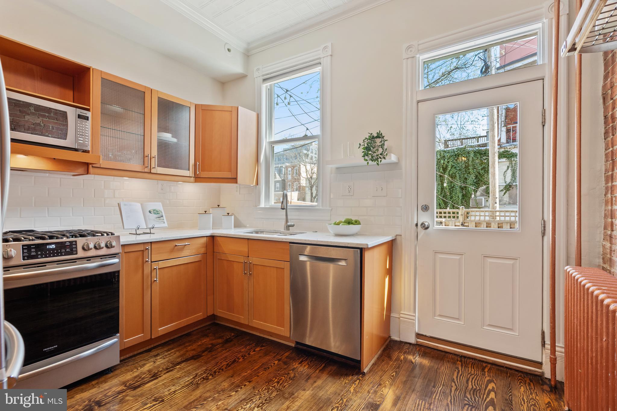 705 7th Street Northeast Washington, DC 20002 - Photo 15 of 48 a kitchen with stainless steel appliances granite countertop a stove and a sink