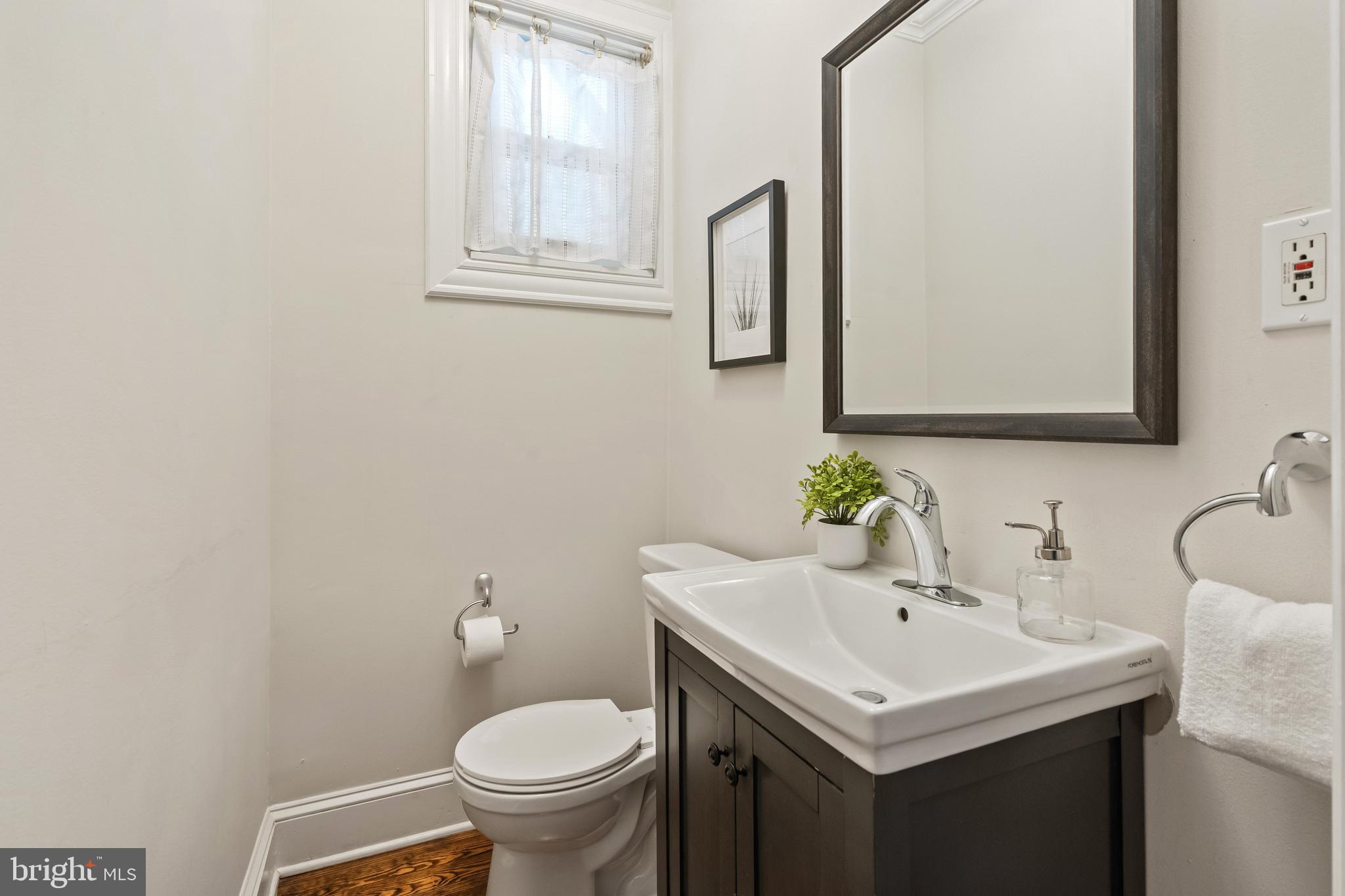 705 7th Street Northeast Washington, DC 20002 - Photo 17 of 48 a bathroom with a sink and a toilet