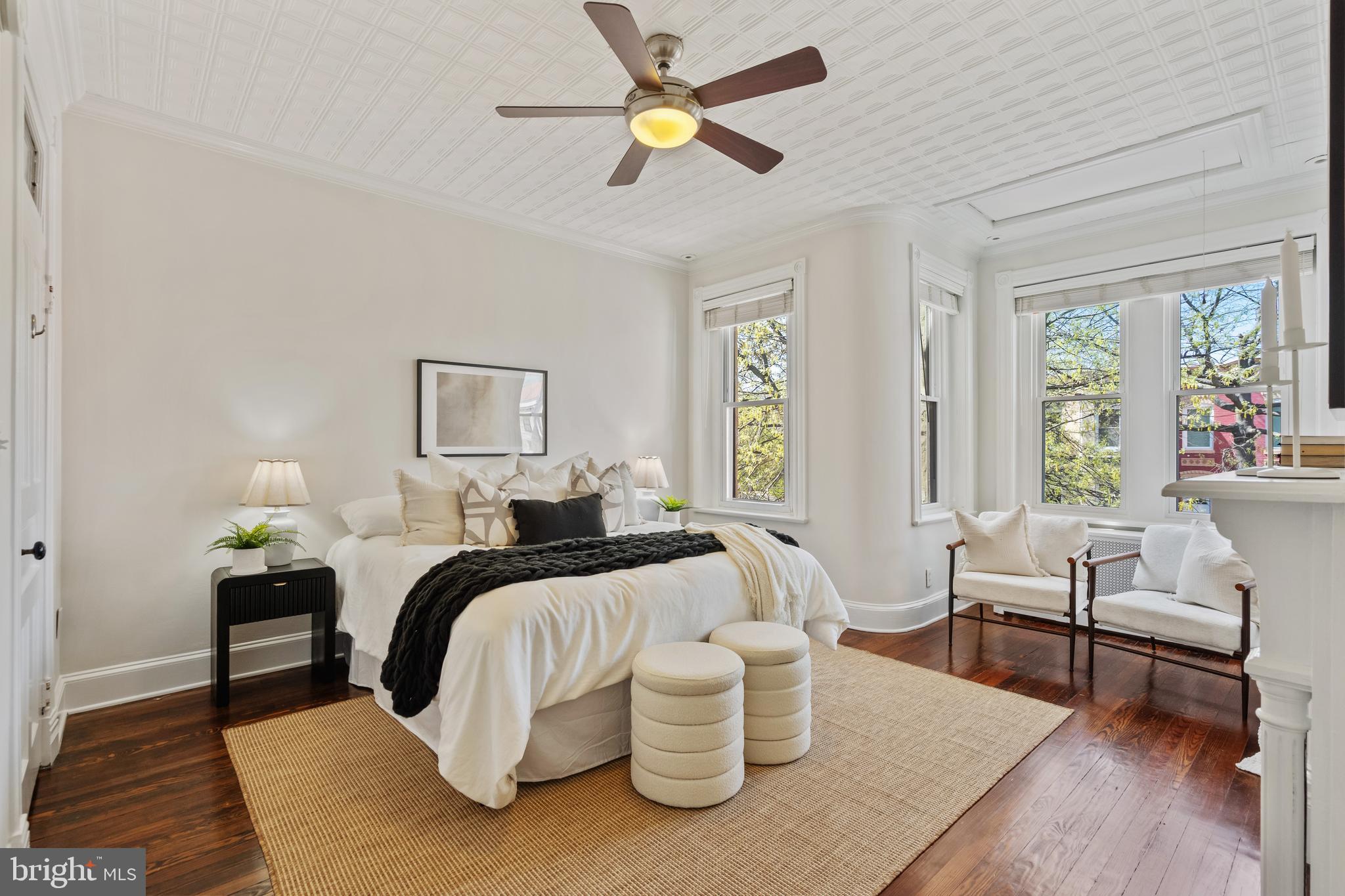 705 7th Street Northeast Washington, DC 20002 - Photo 21 of 48 a bedroom with a bed and a chandelier