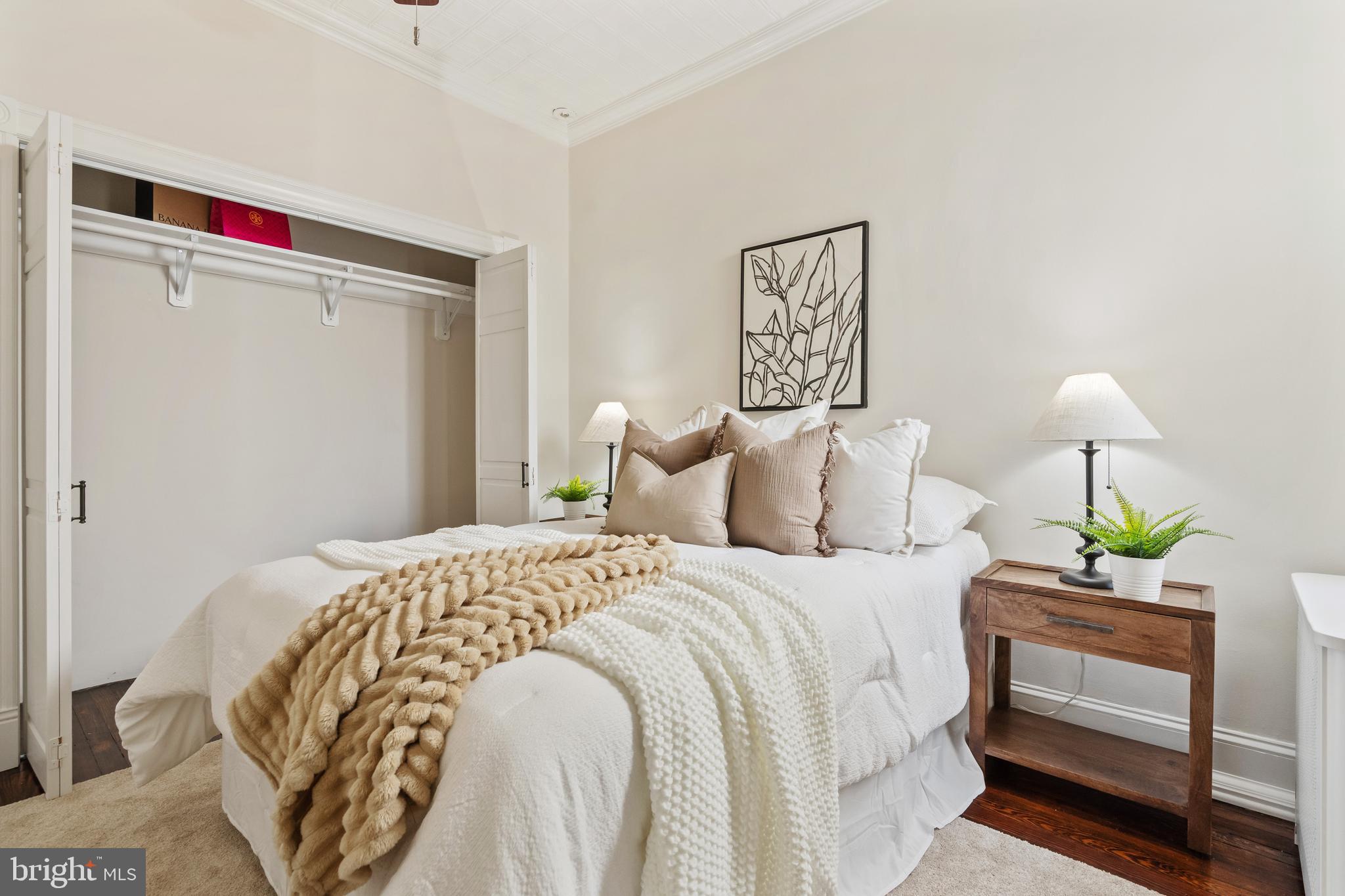 705 7th Street Northeast Washington, DC 20002 - Photo 29 of 48 a bedroom with a bed and a lamp