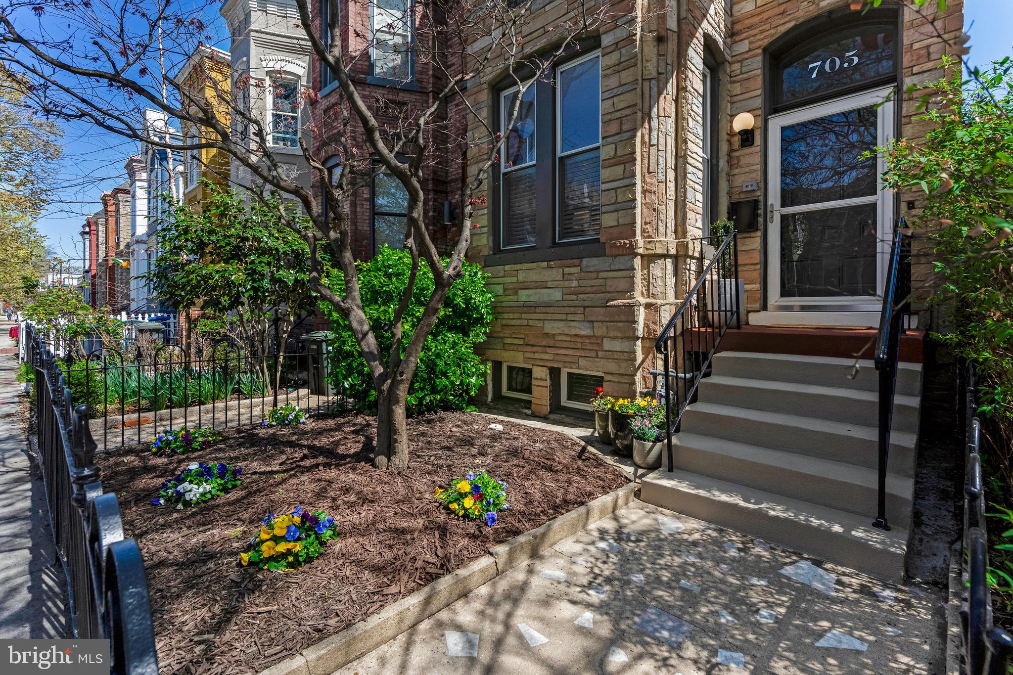 705 7th Street Northeast Washington, DC 20002 - Photo 3 of 48 a view of a pathway with a house in the background