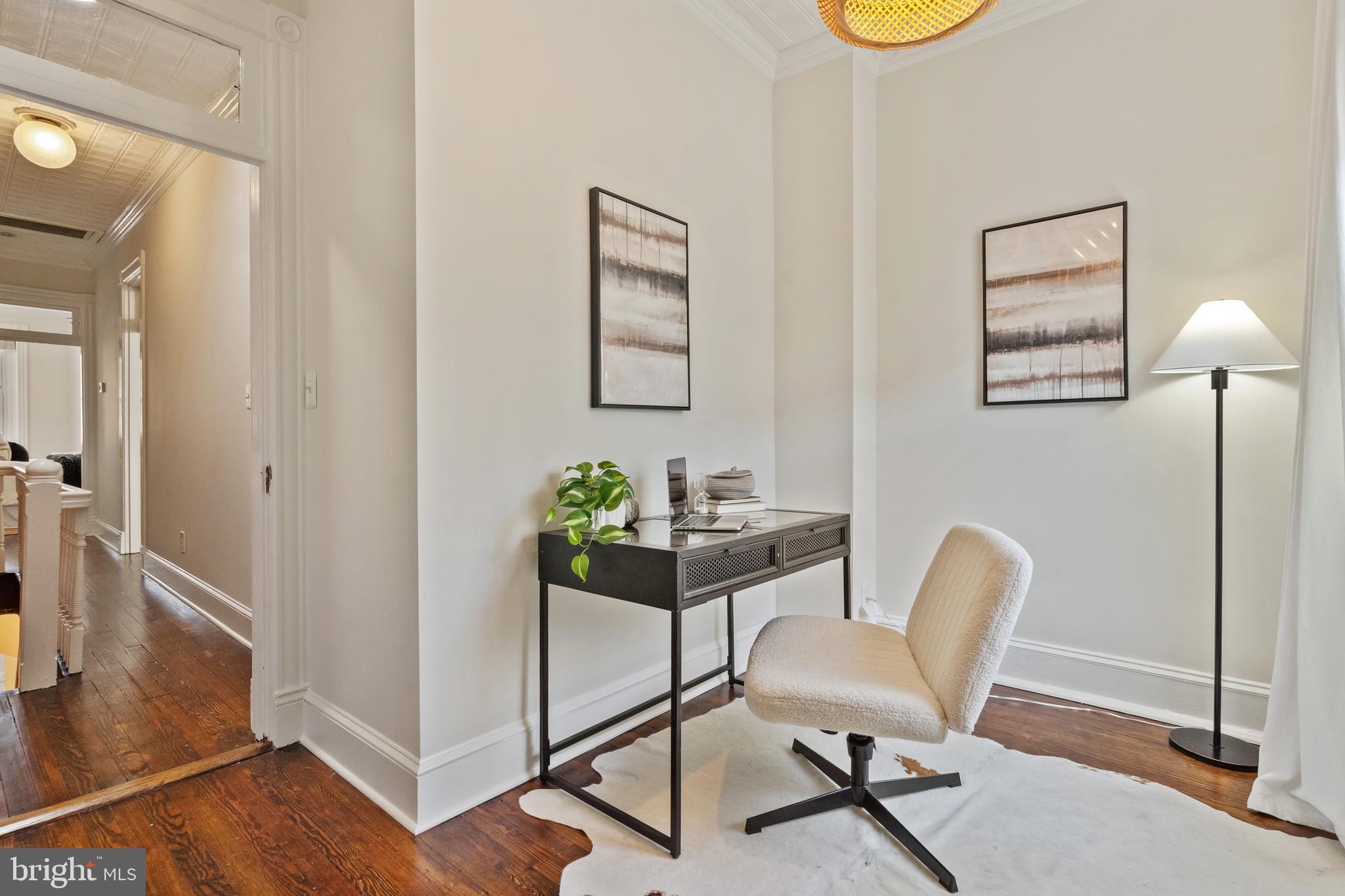 705 7th Street Northeast Washington, DC 20002 - Photo 32 of 48 a view of a workspace with furniture and a window